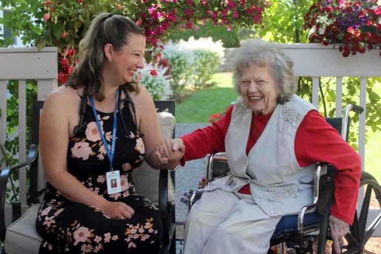Primary care provider with patient on their patio