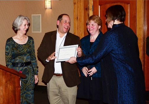 Todd Lawrence receiving the Hospice Dream Team Volunteer Coordinator Award. l to r: Terri Hobbs, HCP