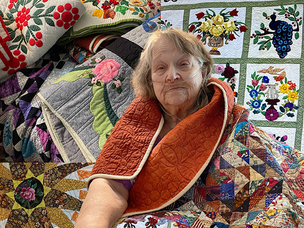 Housecall Providers patient Dorothy Davis, The Quilt Lady in Remote Oregon, with her quilts for the 