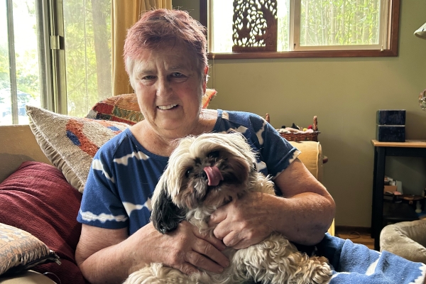 Sheila Yates and her adorable dog, Hazel, share a smile that warms the heart this holiday season.