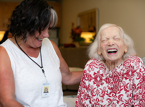 Social worker laughs with her patient